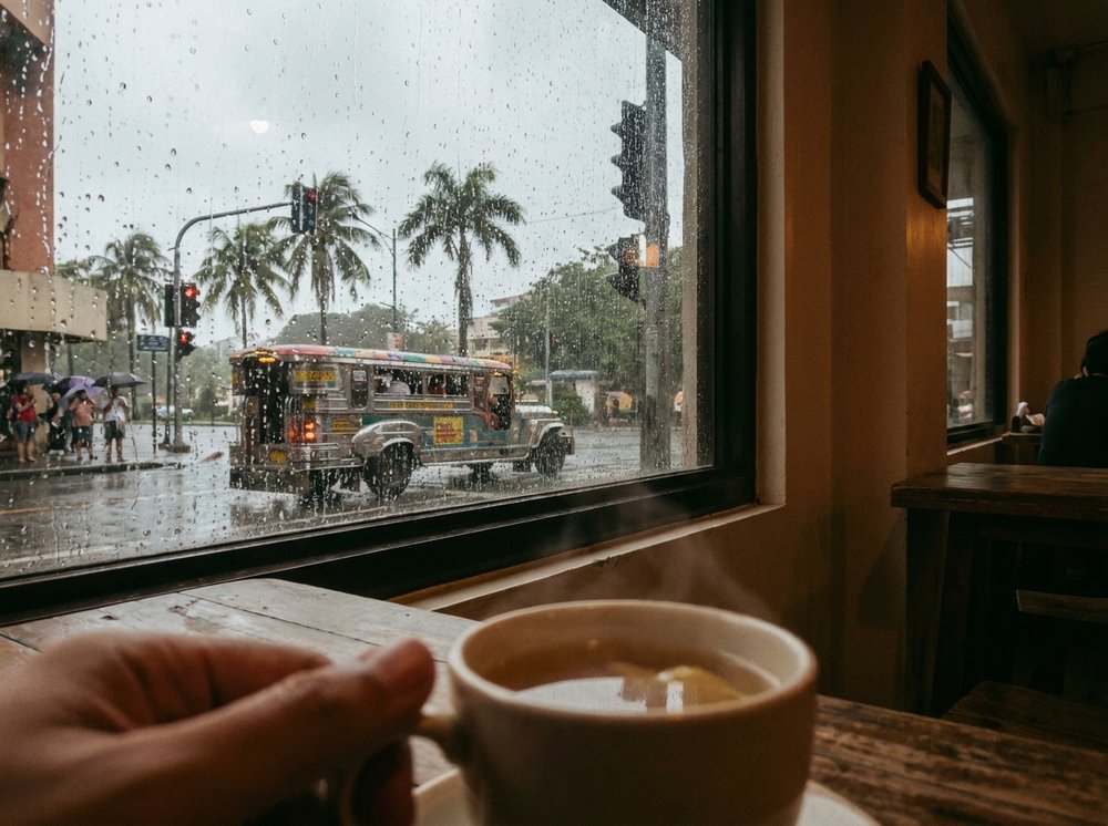 Rain falling over Quezon City rooftops